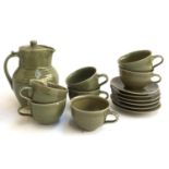 A stoneware coffee set comprising cups (7), saucers (6) and coffee pot