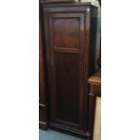 An early 20th century oak narrow hanging cupboard, the door surrounded by bobble molding, 61cmW