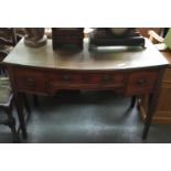 A 19th century bow front dressing table, three drawers on square tapered legs, with glass top,