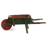 A vintage wooden child's wheelbarrow, 111cmL