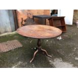 A 19th century oak tip-top table, on tripod cabriole base, 96cmD