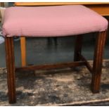 A George III style oak footstool, molded square section legs with H stretcher