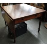 A 19th century mahogany drop leaf dining table, single end drawer opposite blind drawer, on ring