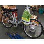 An Assist Step-Thru Hybrid Electric Bike, with charger, helmet and instruction manual
