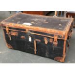 A large leather travel trunk, initialled L.I.E, various travel stickers, with key, 91cmW; together