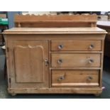 A pine sideboard with gallery above cupboard door beside three drawers, 121cmW