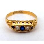 An 18ct gold dress ring set with white and blue stones, gross weight 2.1g, size Q