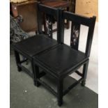 A pair of black lacquered and mother of pearl inlaid occasional chairs