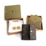 A Louis Vuitton monogram leather wallet, in Louis Vuitton presentation box with sleeve and