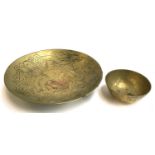 A Chinese brass bowl with dragon design interior, 27cmD; together with a smaller Chinese brass bowl,