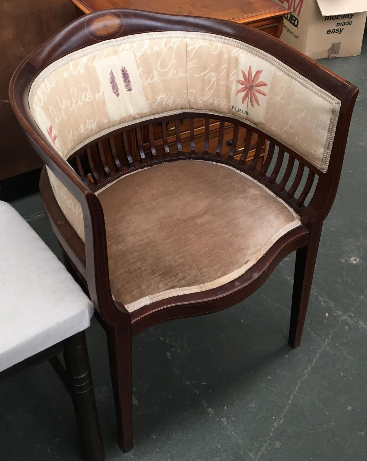 An early 20th century mahogany and marquetry captain's chair