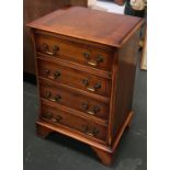 A walnut bedside cabinet, four drawers, labelled for Hallett & Son. ltd Weymouth, 47x36x72cmH