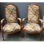 A pair of French high back open armchairs