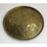 An Indian chased brass tray, 58cmD
