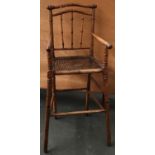 A 19th century turned faux bamboo and cane child's highchair, 93cmH