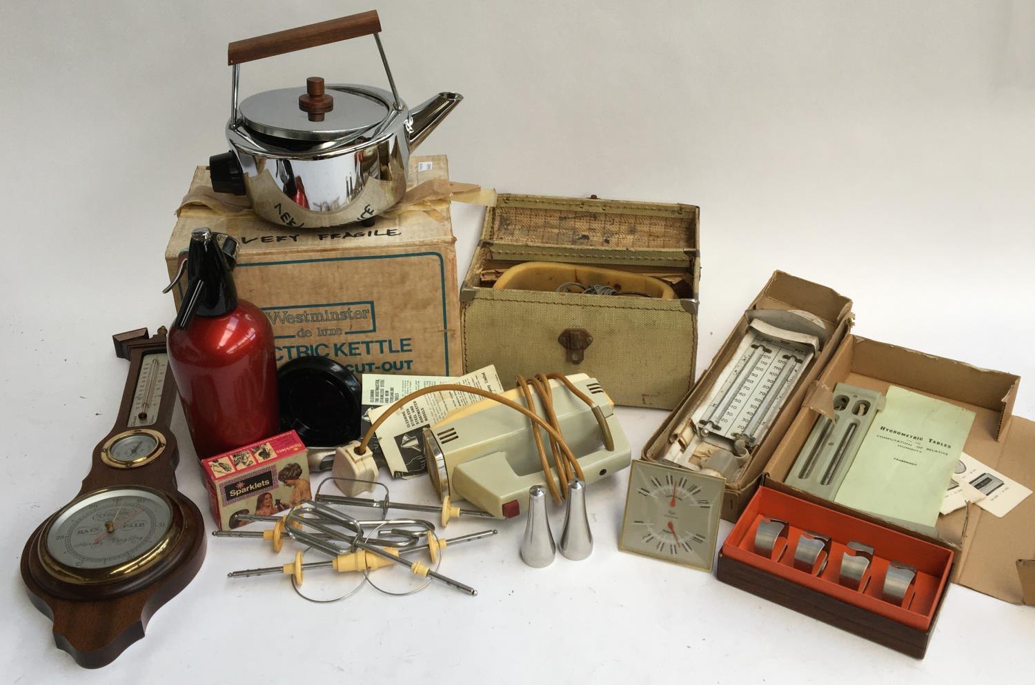 A lot of vintage kitchenalia, several electric kettles, an electric whisk, Sparklets soda siphon,
