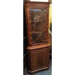 A glazed standing corner cupboard, 180cmH