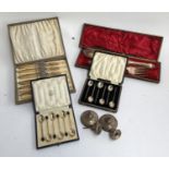 A cased set of six silver coffee bean terminal coffee spoons by Mappin & Webb, together with a