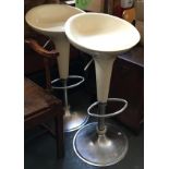 A pair of retro swivel chromed bar stools, with foot rests, 89cmH