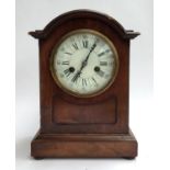 A mahogany cased mantel clock, 14 day striking movement, roman numerals with arabic minutes, 34cmH