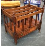 A 20th century mahogany three section canterbury, with single drawer, on brass casters, 56cmW