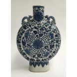 A Chinese blue and white moon vase, Yong Zheng style with dragon lugs and floral motifs, 26cmH