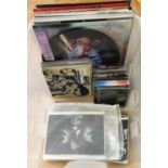 A box of mostly new and sealed LPs and singles from Rough Trade and One Little Indian