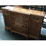 A walnut veneer break front sideboard, by Hallet & Sons ltd Weymouth, four drawers flanked by