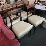 A set of four 19th century mahogany dining chairs, reeded supports, stuffover seats on turned