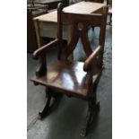 An unusual 'refectory' style open arm chair, oak, the top with scrolling acanthus detail; together