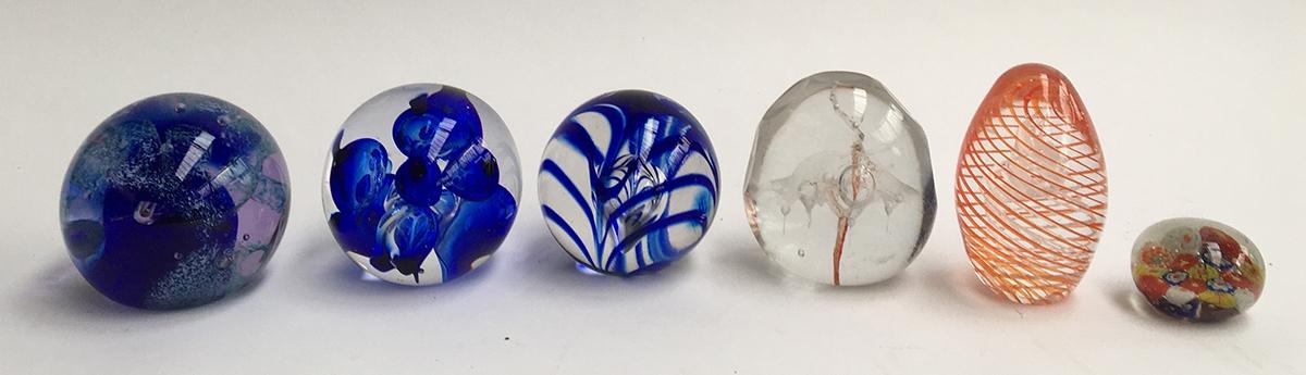 Six glass paper-weights including Caithness, Langham Art Glass, and others