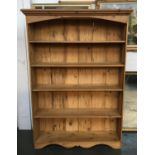 A large pine bookcase, with five shelves, 130cmW