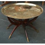 A circular brass seven metals Russian tray table, on folding six leg base, mark to top 78cmD