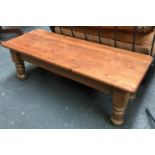 A pine coffee table on substantial turned legs, 120x48x41cmH