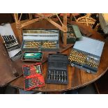 A large lot comprising a quantity of cased sets of drillbits, both metalworking, woodworking