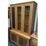 A glazed oak cabinet over cupboard base with internal shelves, 119cmW, 200cmH
