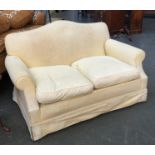 A two seater sofa upholstered in yellow fabric, approx. 143cmW