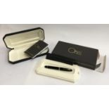 An Omas ball point pen Rolling Arte Italiana 207, purchased from Harrods, in leather slip case and