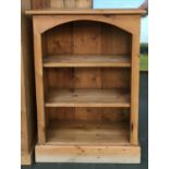 A small pine bookshelf, of two shelves, on plinth base, 66cmW