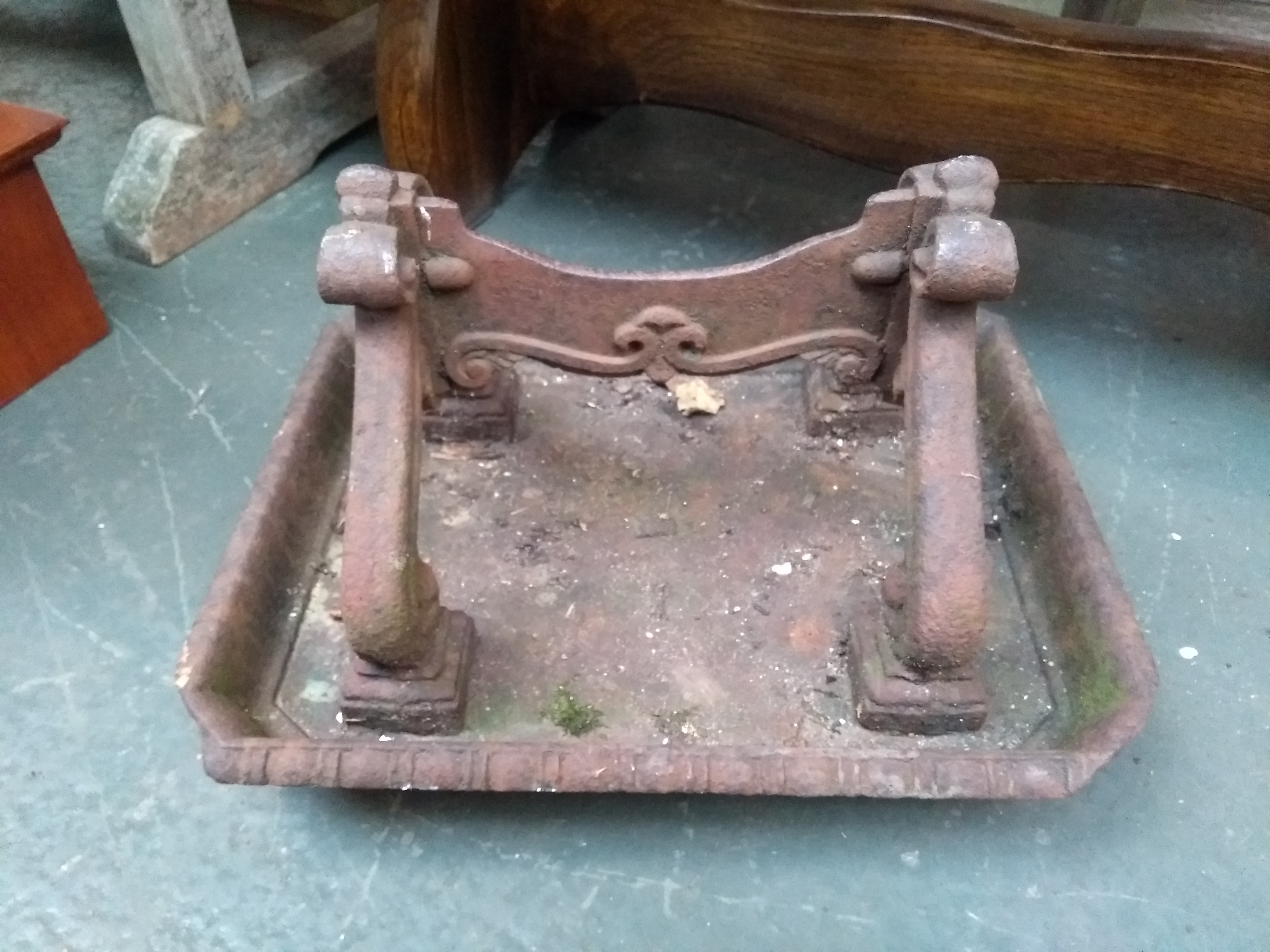 A cast iron boot scraper