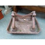 A cast iron boot scraper