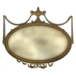 An Adams style oval wall mirror, the bevelled plate within an egg and dart moulded rim, the top