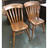 A pair of 19th century latheback kitchen chairs, shaped elm seats, on ring turned legs, with H