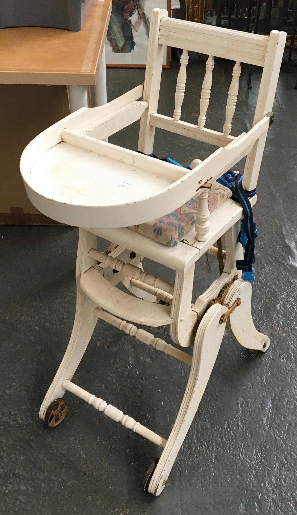 A white painted metamorphic child's high chair