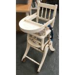 A white painted metamorphic child's high chair