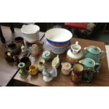 A mixed lot of ceramics to include two Denby jugs; a David Cleverly jug and candlestick etc