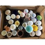 A mixed lot of eggcups to include Poole pottery and other novelty designs, approx. 33