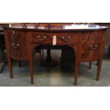 A strung and crossbanded Regency mahogany break front sideboard, single drawer flanked by one deep