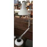 A white anglepoise lamp