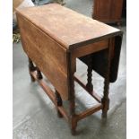 An oak gateleg table of barleytwist supports